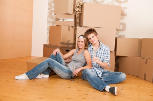 Professional movers handling furniture in a Sydenham street