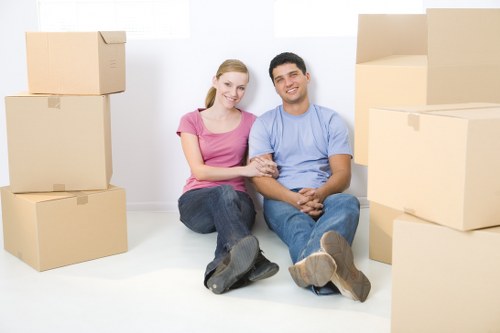 Local moving team loading furniture into a removal van