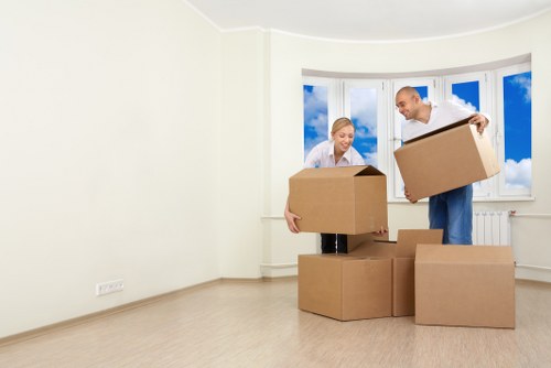 Local movers organising labelled boxes for a Sydenham property