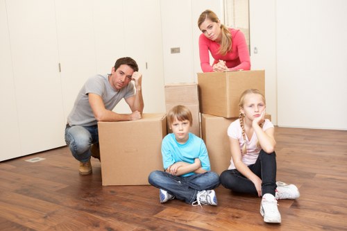 Professional movers loading household furniture for a Sydenham relocation