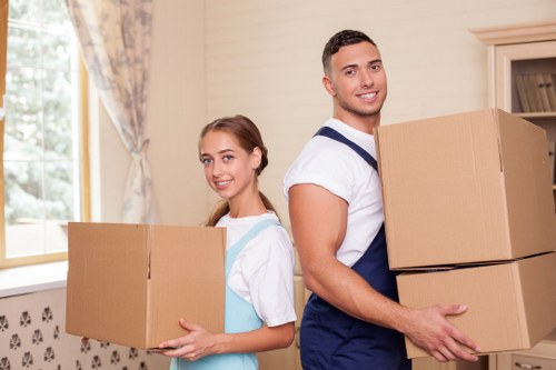 Packed boxes and moving equipment ready for a Sydenham home relocation
