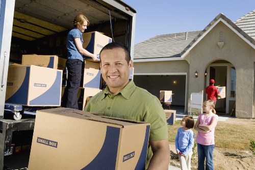 Packed boxes and furniture ready for local moving day