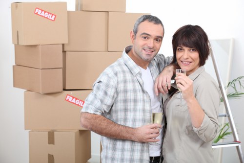 Loading furniture into a van for a Sydenham removal job