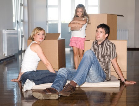 Packed boxes and furniture prepared for a house move in Sydenham